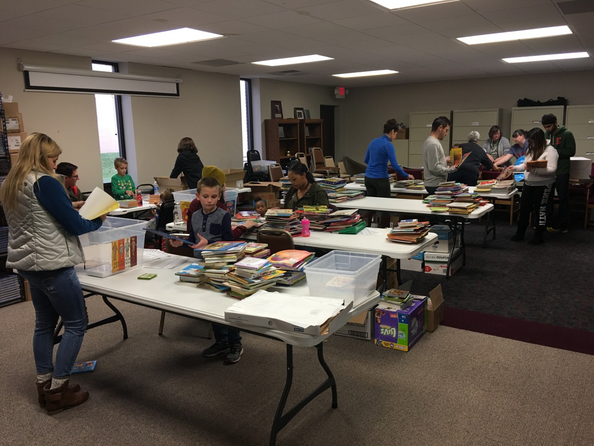 Volunteers sorting and organizing donated books